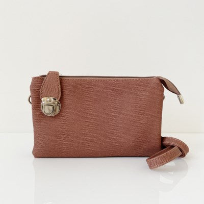 Terra textured multi pouch wristlet/crossbody