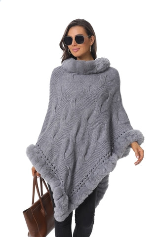 Grey knit poncho with faux fur trim