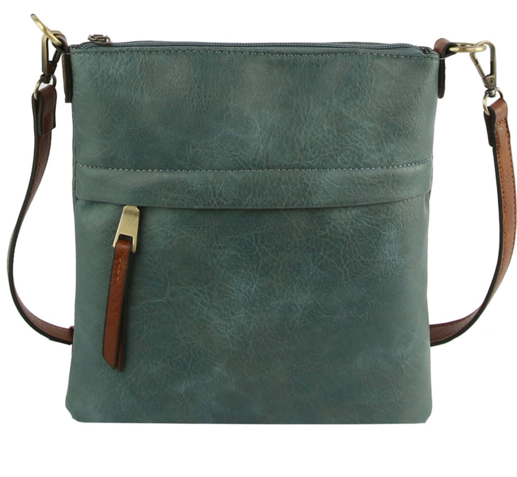 Denim crossbody with brown strap and zipper pulls